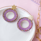 ARETES REDONDOS LILA ESTRELLA